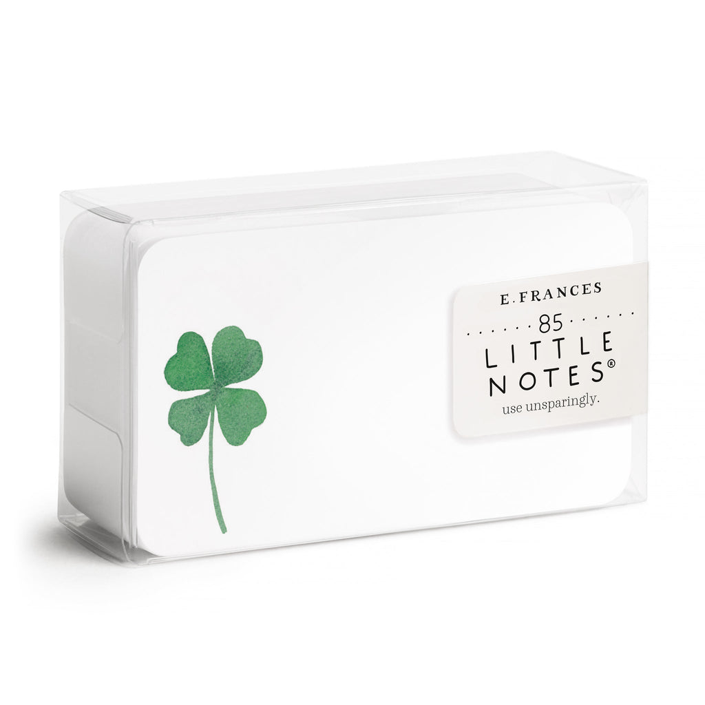 Tiny notes with white background and image of a green shamrock on left side. 