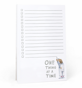 Image of notepad with white background and lines with checkboxes. Image of a dog in overalls painting the lines in black.  Black text says "one thing at a time". 