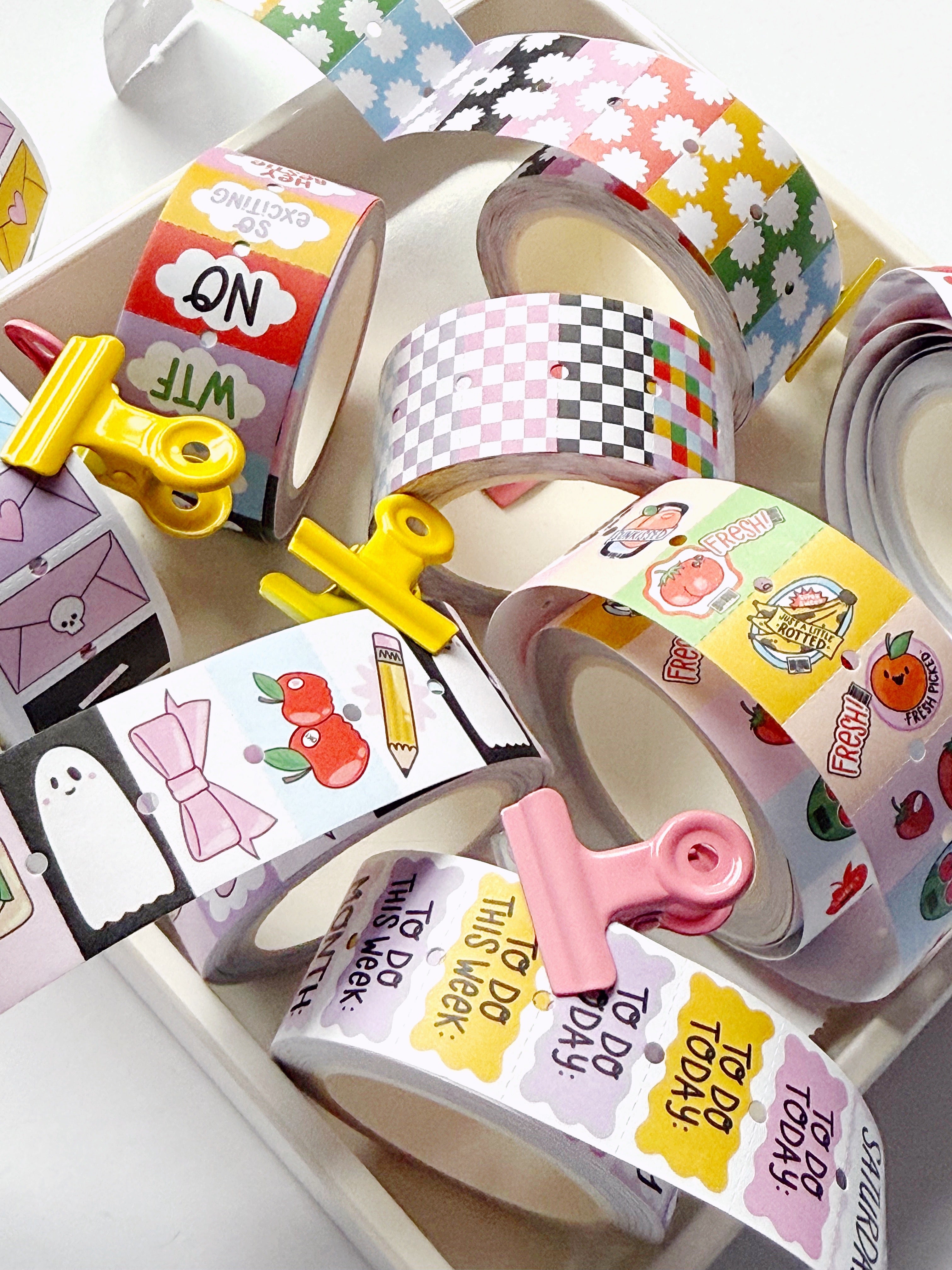 Rolls of stickers n different patterns and colors.