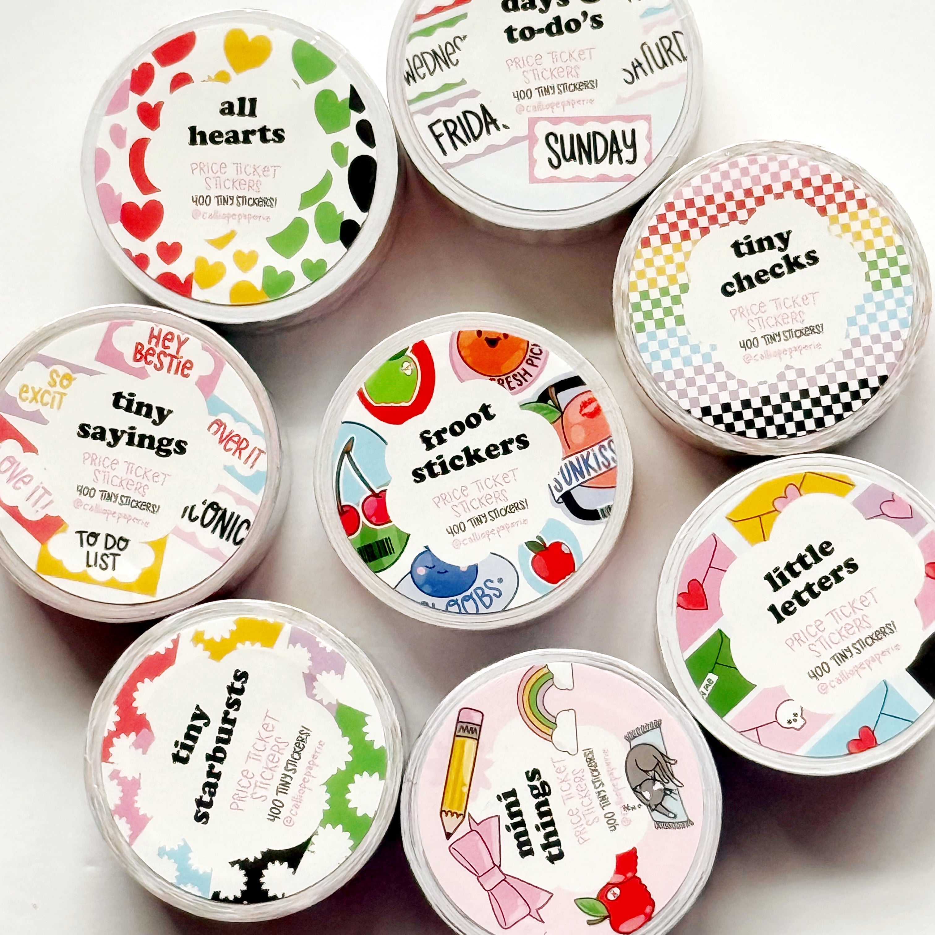 Rolls of stickers with packaging styles including "All hearts, Days and to dos, tiny checks, little letters, froot stickers, mini things, tiny starbursts, tiny sayings".