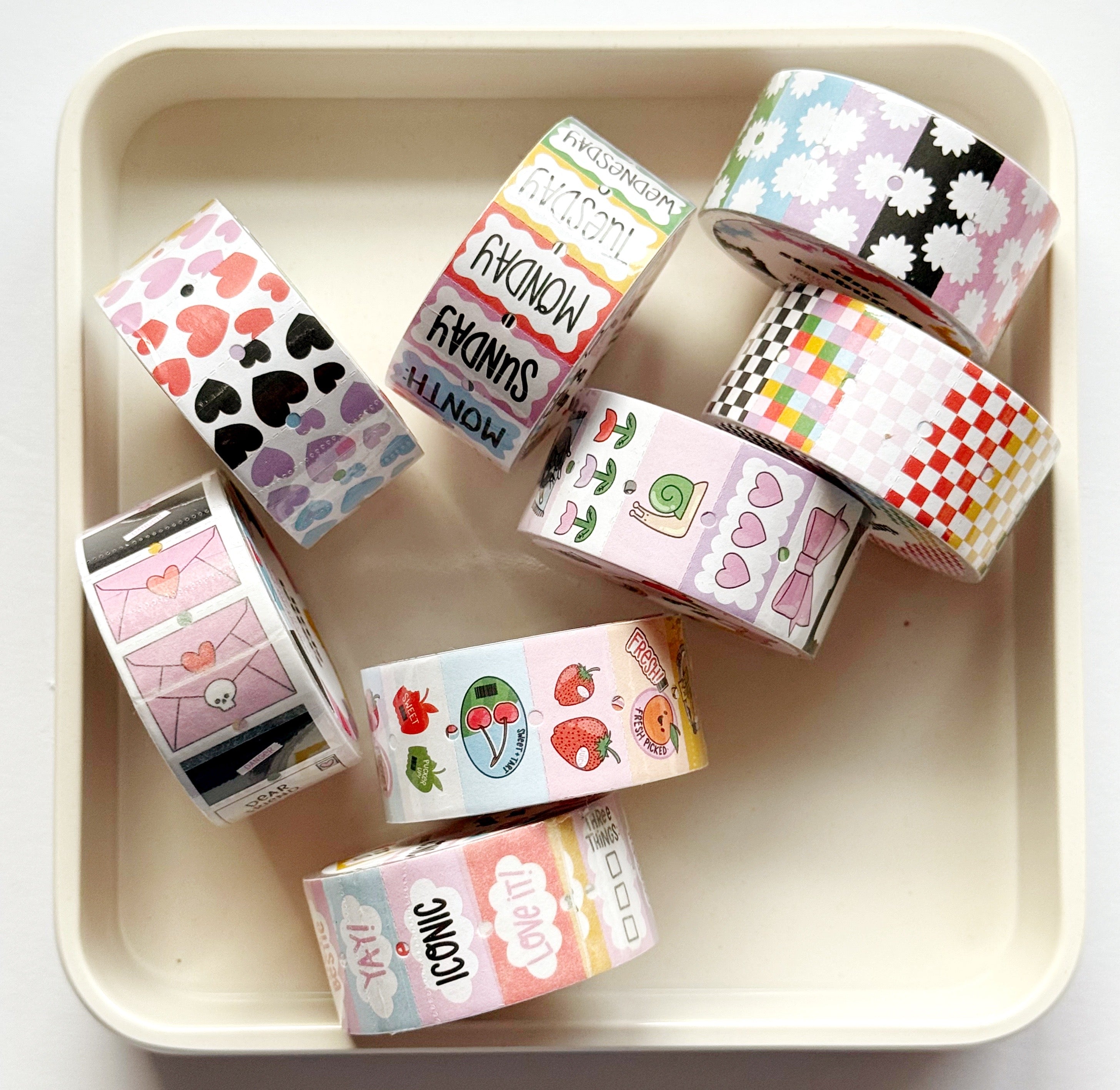 Various styles of small sticker label rolls.