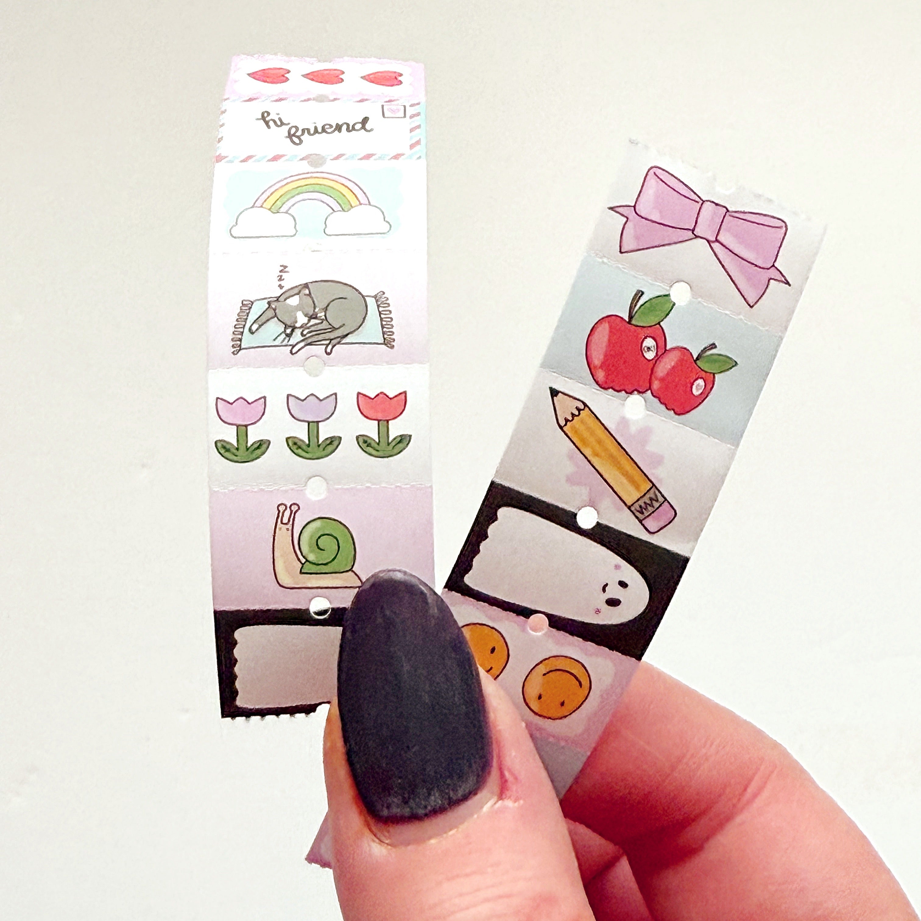 Small stickers with images of flowers, napping kitty, apples, bows, pencil, ghost, and snails.
