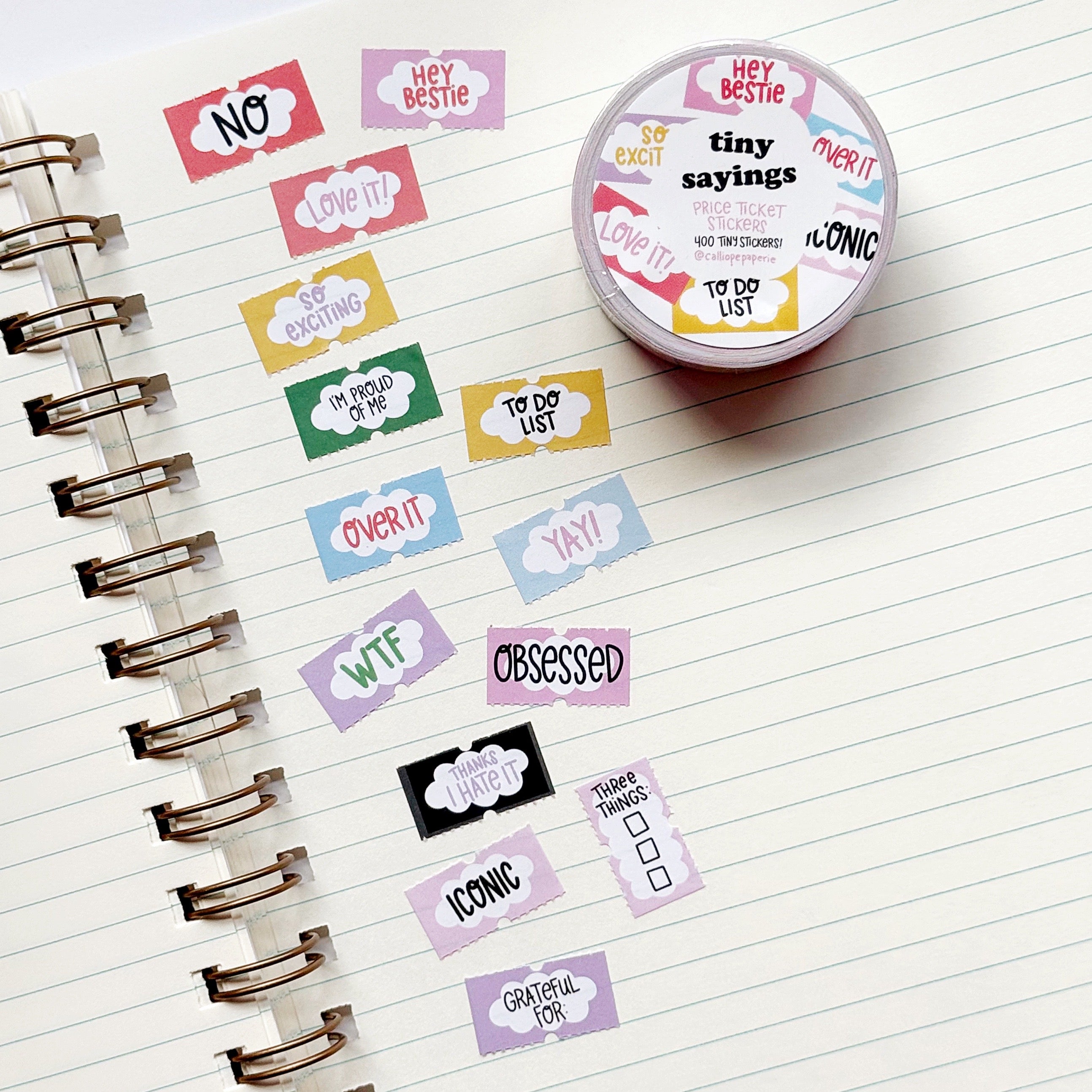 Decorative tiny stickers with sayings on them in black text says, "Iconic", "Love it!", "No", "So exciting" and "WTF". 