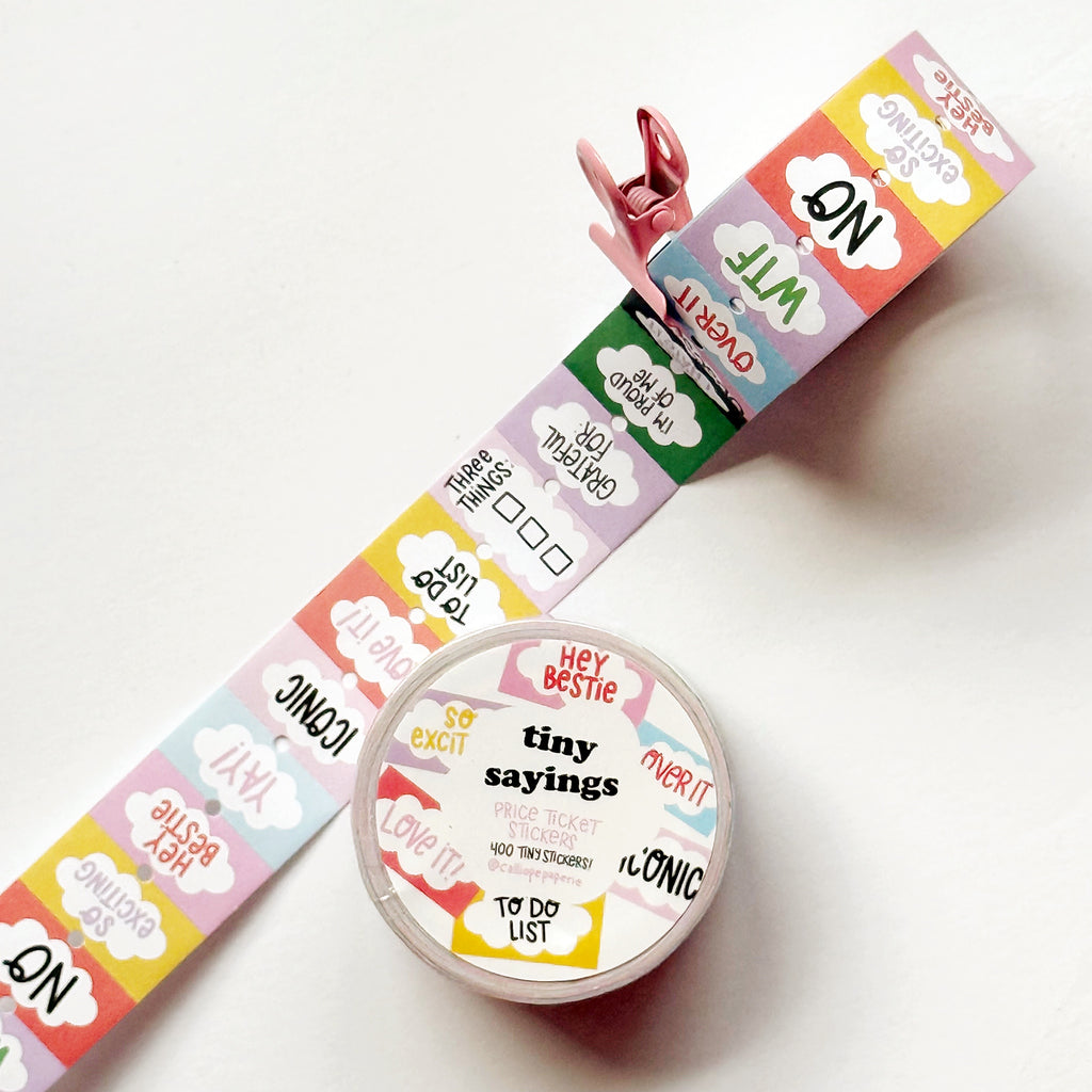 Decorative tiny stickers with sayings on them in black text says, "Iconic", "Love it!", "No", "So exciting" and "WTF". 