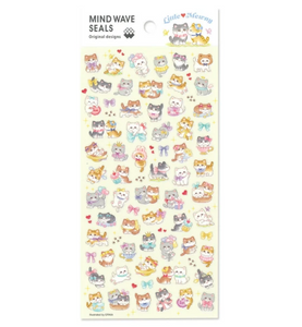 Sticker sheet with yellow background and images of kitties playing.