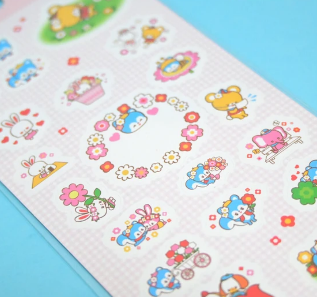 Decorative sticker sheet with images of tiny animals in bright colors.