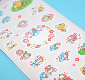 Decorative sticker sheet with images of tiny animals in bright colors.