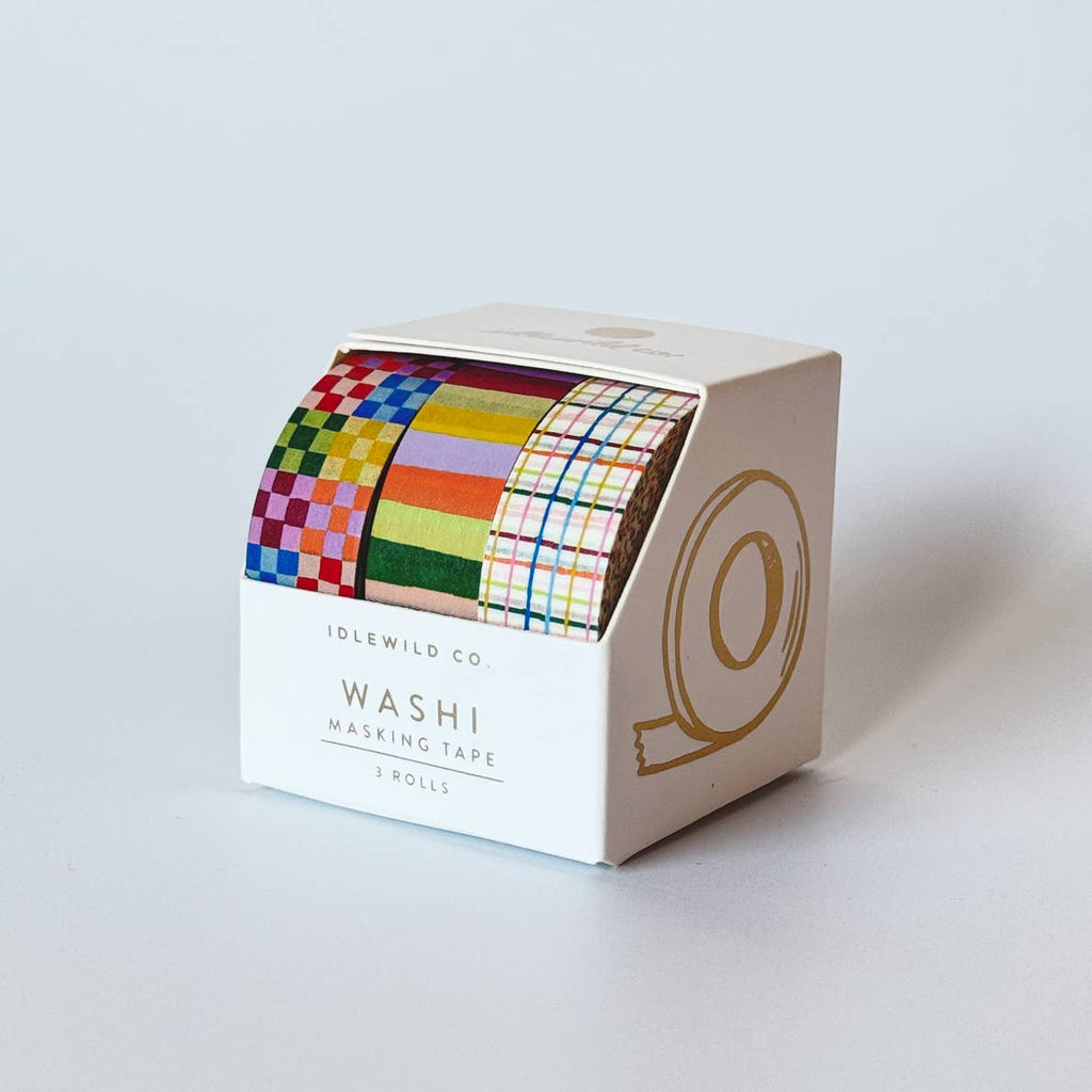 Image of three rolls of washi tape, all are in rainbow colors, checkerboard, stripe and plaid patterns.