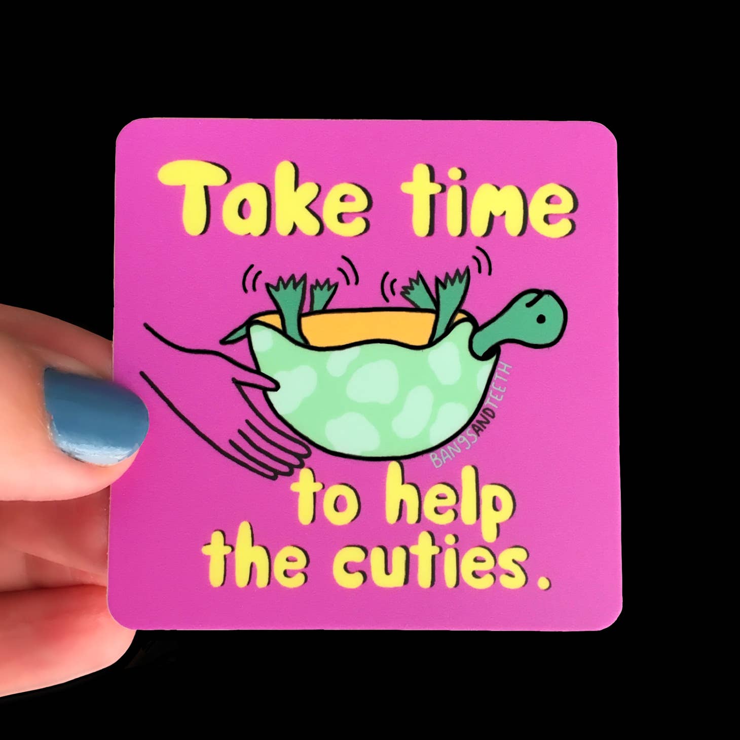 Square sticker with pink background with image of green turtle upside down. Yellow text says, "Take time to help the cuties.".