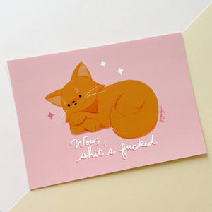 Pale pink background with image of orange cat with white text says, “Wow, shit’s fucked”.     