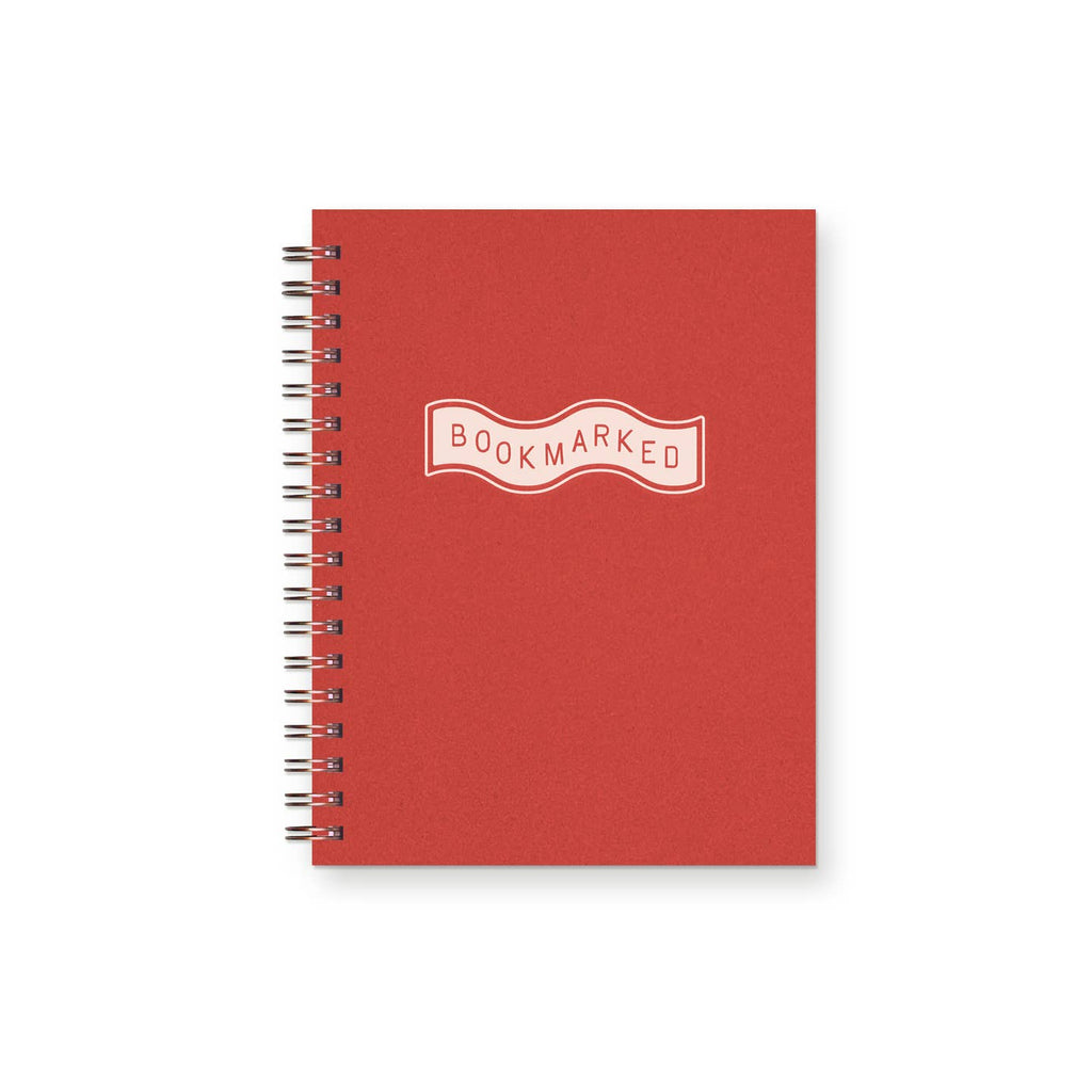 Notebook with red over and ivory banner with red text says, "Bookmarked". 