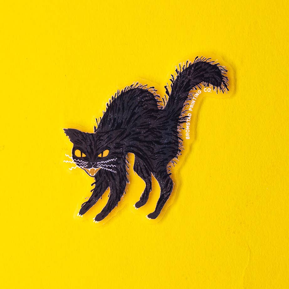 Decorative sticker in the image of a black cat with an arched back.