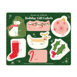 Gift tag sheet with green background and images of labels with dog, ornament, string of lights, holly, reindeer and stocking with area to write names, red text says, "To: From:". 