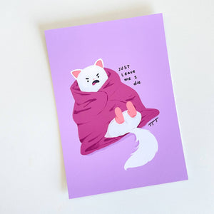 Lavender background with image of white cat wrapped in a pink blanket wearing pink socks. Black text says, “Just leave me 2 die”.    