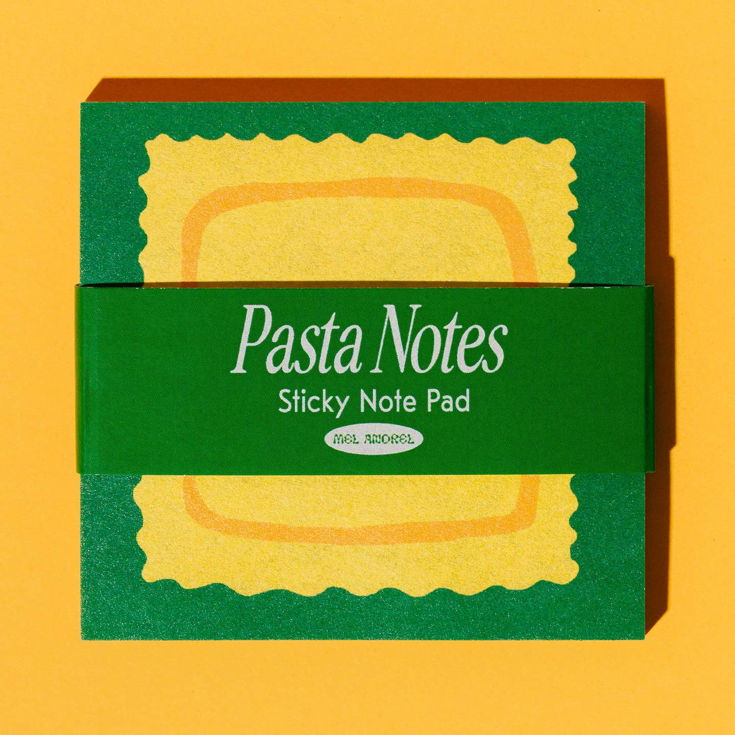 Sticky notepad with green background and yellow ravioli in center.