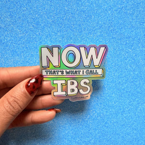 Decorative sticker with holographic details and white text says, "Now that's what I call IBS". 