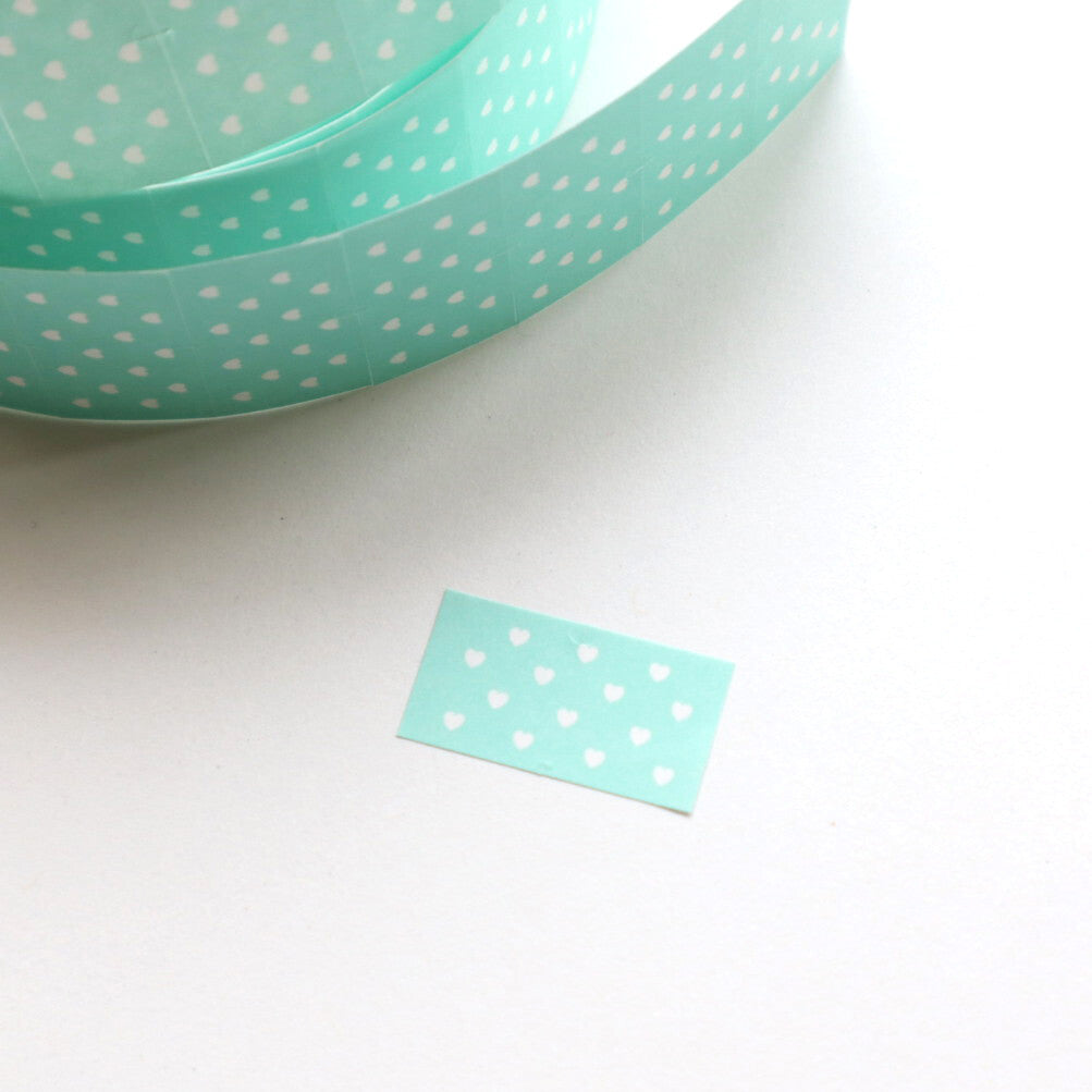 Label sticker with aqua background with white dots