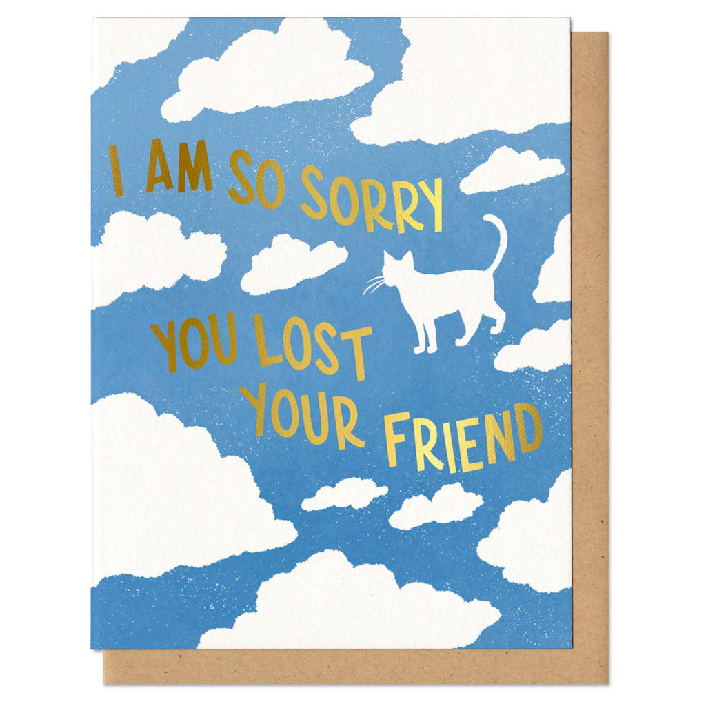 Greeting card depicting clouds in a blue sky, one cloud shaped like a cat. Text says "I am so sorry you lost your friend" in gold foil.