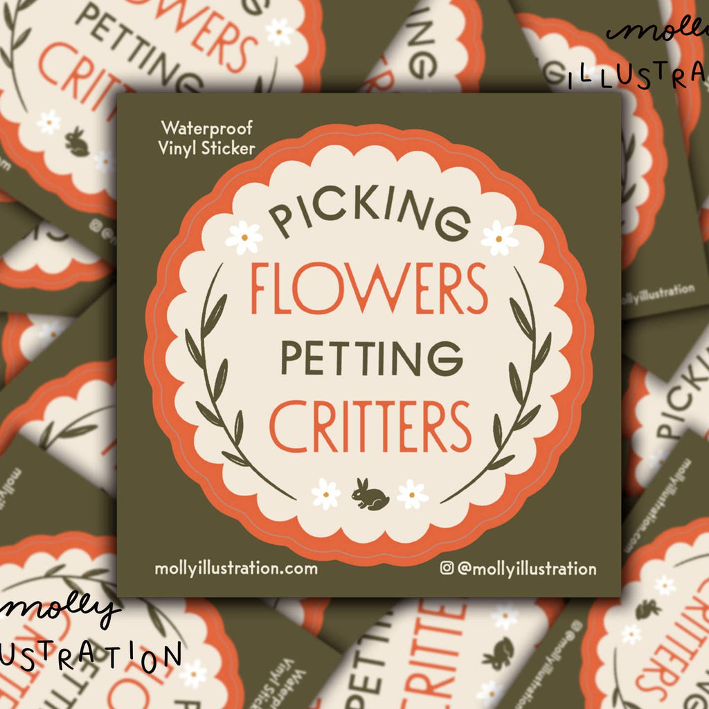 Decorative sticker with cream center and orange border with green and orange text says, "Picking flowers petting critters". 
