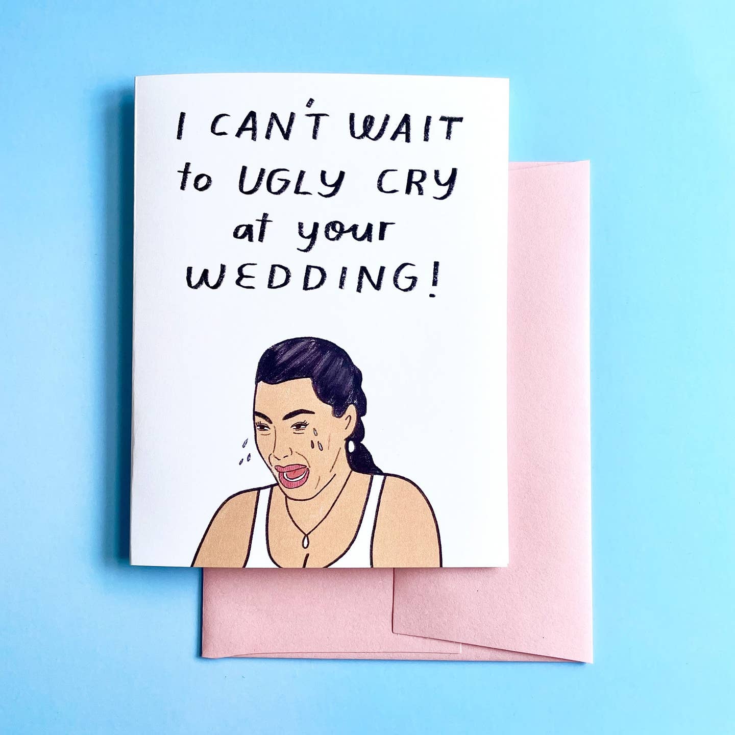 Greeting card with white background and image of Kim Kardashian crying. Black text says, "I can't wait to ugly cry at your wedding!". Pink envelope included. 