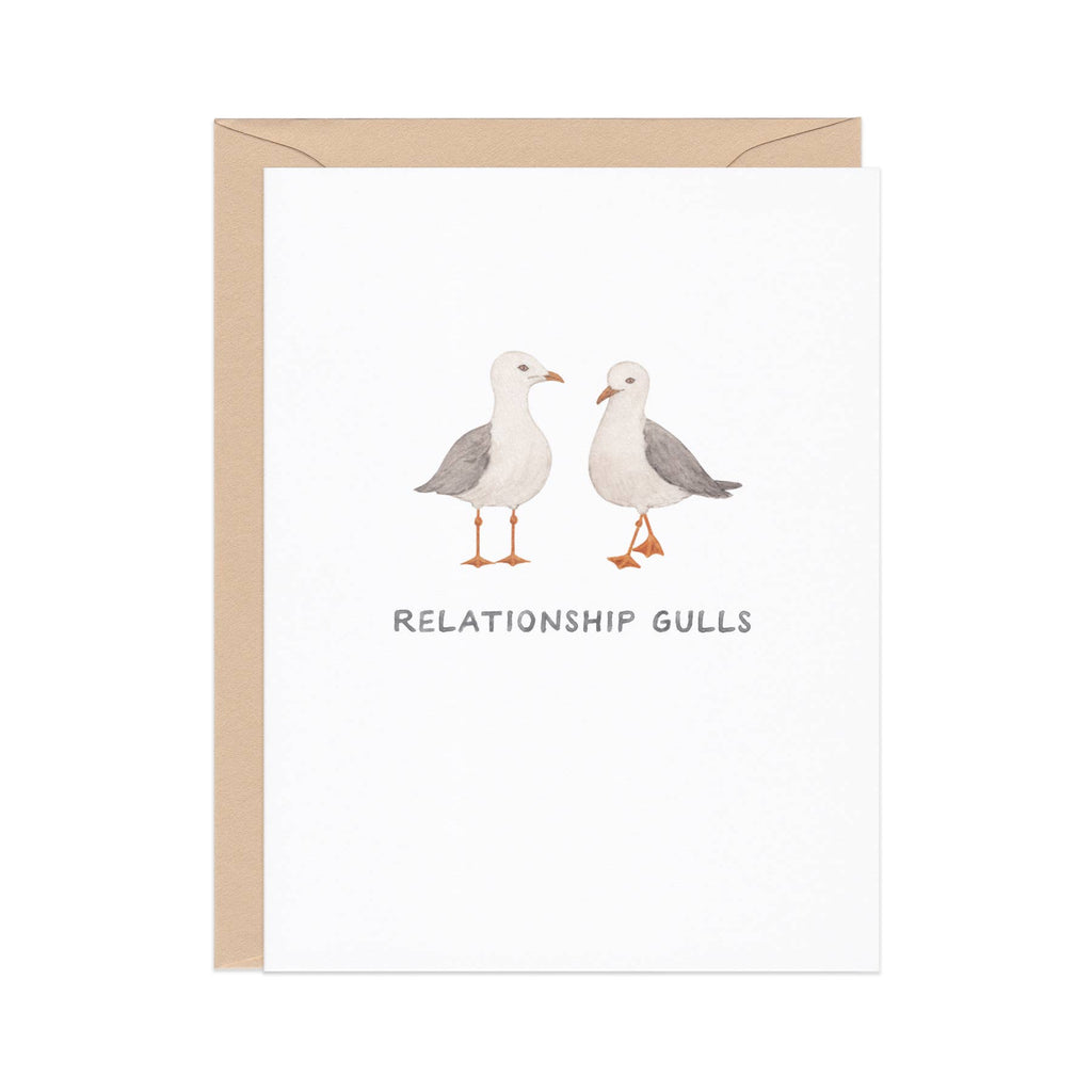 Greeting card with white background and images of two seagulls with grey text says, "Relationship gulls". Kraft envelope included.