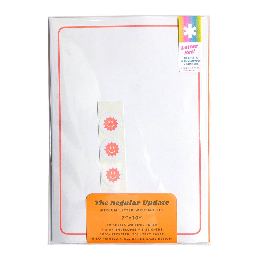 Image of white paper with bright orange line for border and sticker with white background and orange suns. 