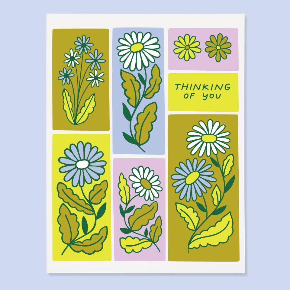 Greeting card with boxes in blue, green and lilac with flowers in the boxes. Green text says, "Thinking of you". Envelope included.