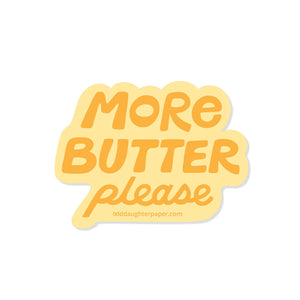 Decorative sticker with yellow background and gold text says, "More butter please".