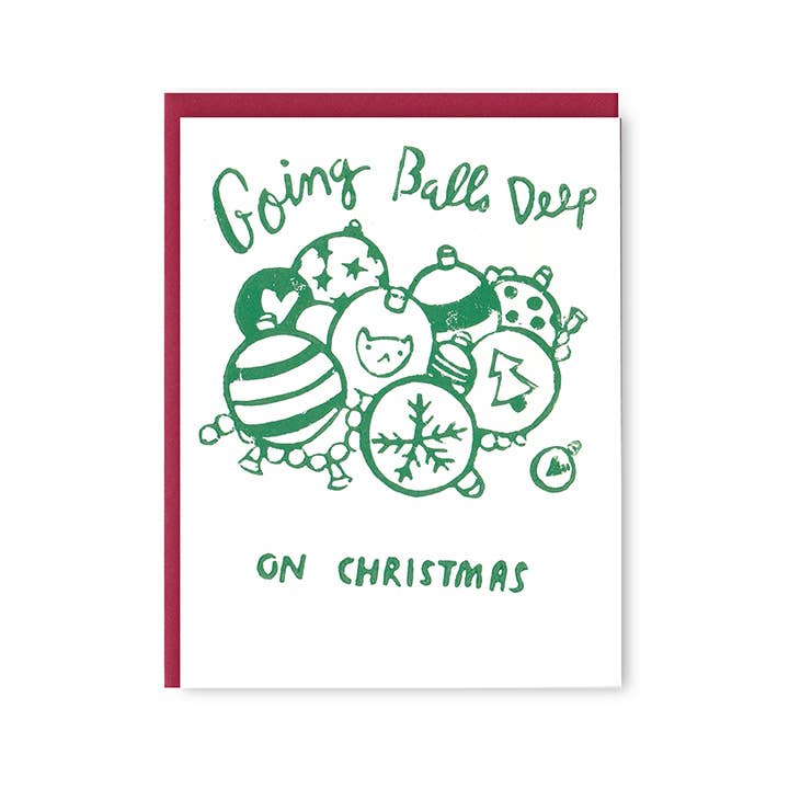 Greeting card with white background and image of green outlined holiday balls with green text says, "Going balls deep on Christmas". Red envelope included. 