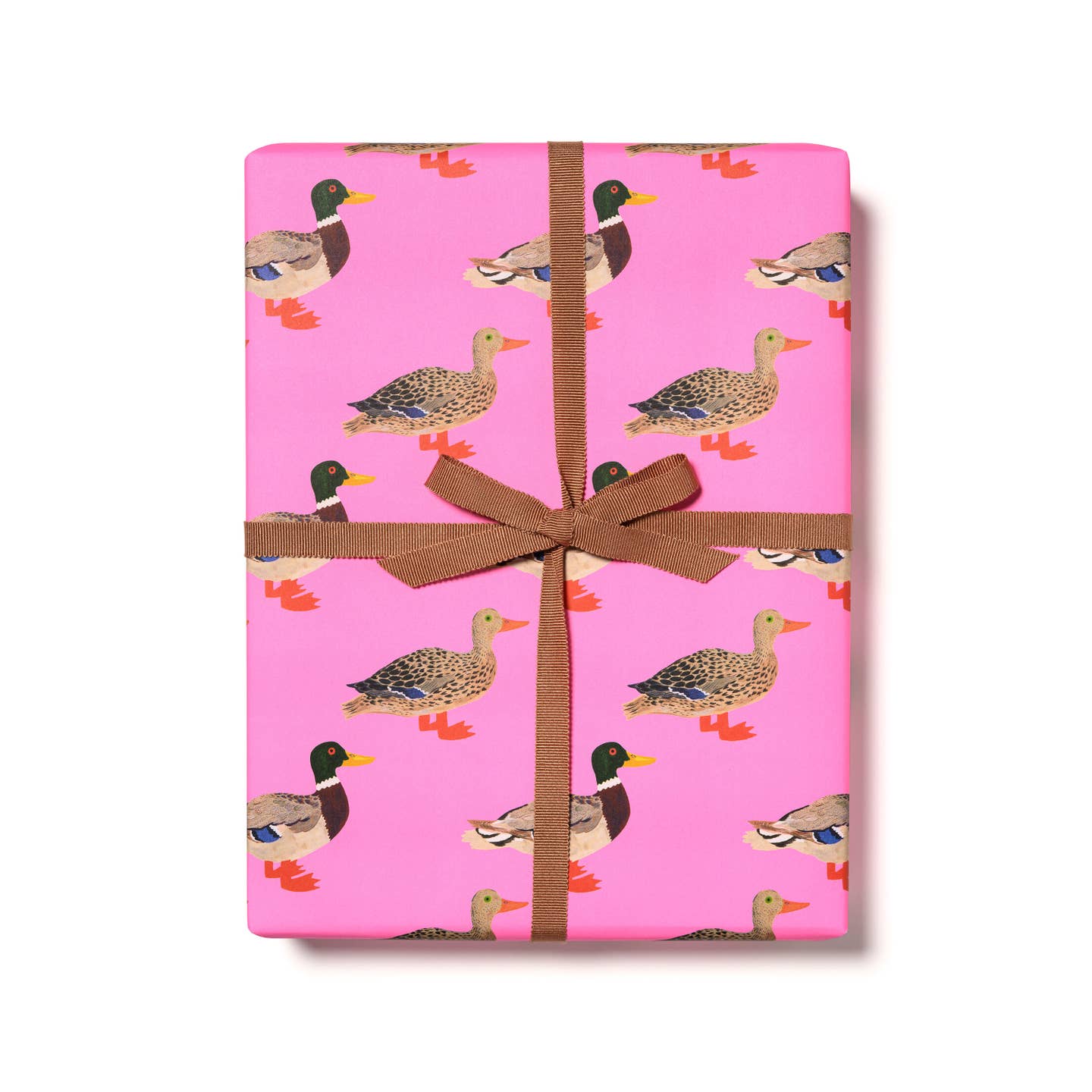 Gift wrap with pink background and images of ducks in brown, tan and orange. 