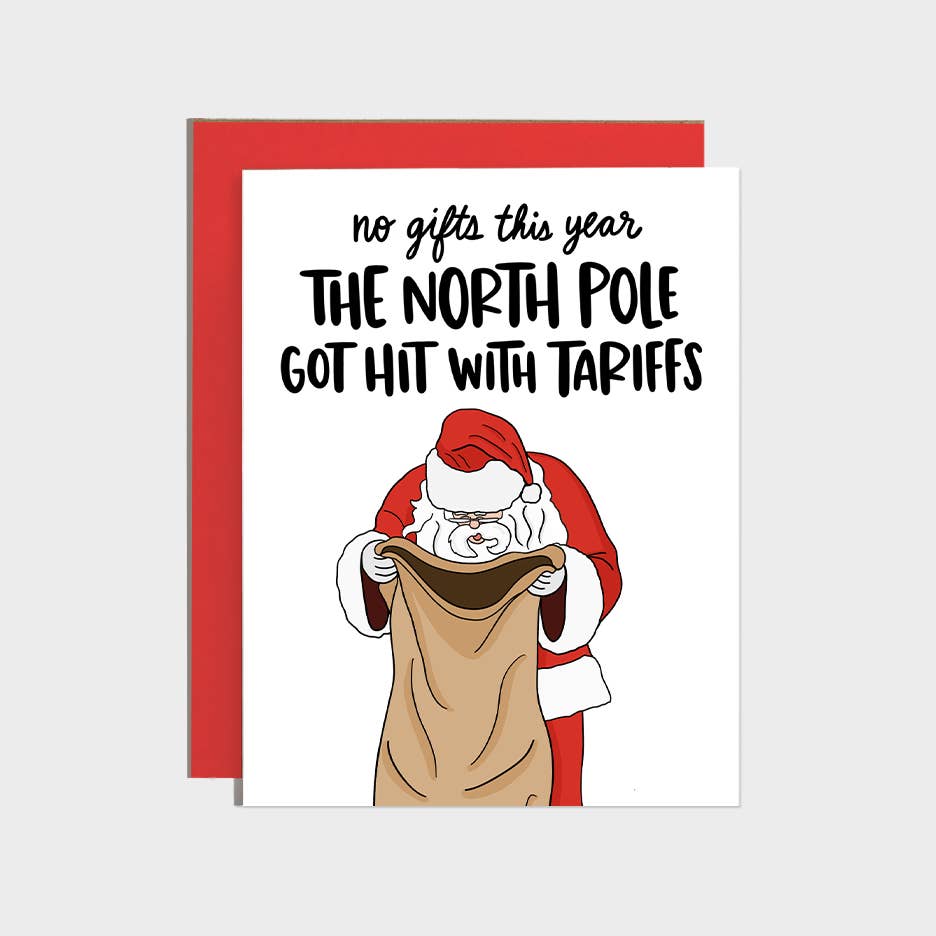 Greeting card with white background and image of Santa looking into his sack and black text says, "No gifts this year the North Pole got hit with tariffs". Red envelope included.