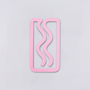 Plastic pink bookmark in rectangle with squiggles.