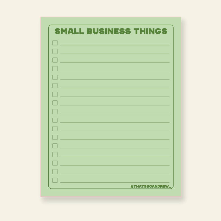 Notepad with green background with green text says, "Small Business Things" with green lines for writing and checkboxes on left of lines. 