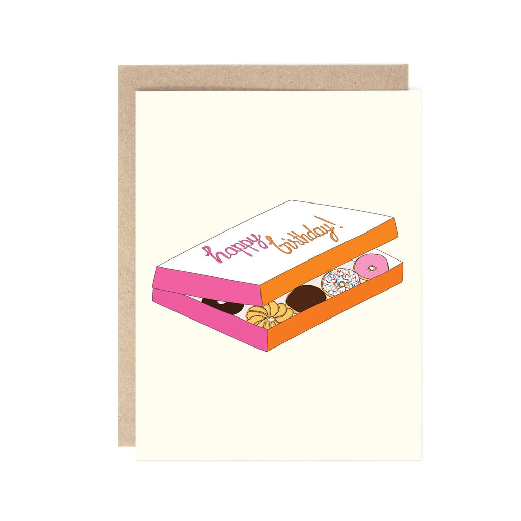 Greeting card with white background and image of a dozen of donuts in a DD box with pink and orange text says, "Happy Birthday!". Kraft envelope included. 