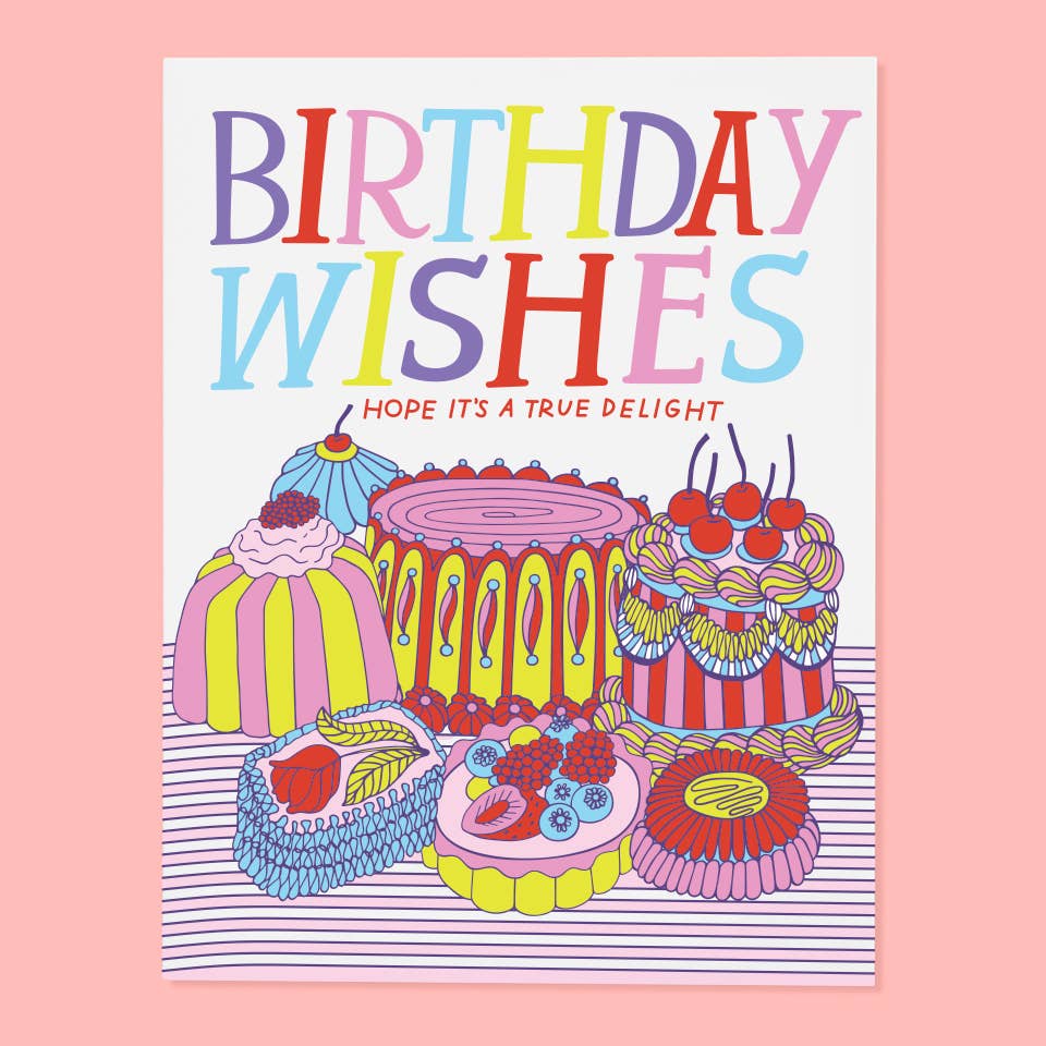 Greeting card with white background and images of cakes in pink, red, yellow and blue with colorful text says, "Birthday wishes, hope it's a true delight". Envelope included.