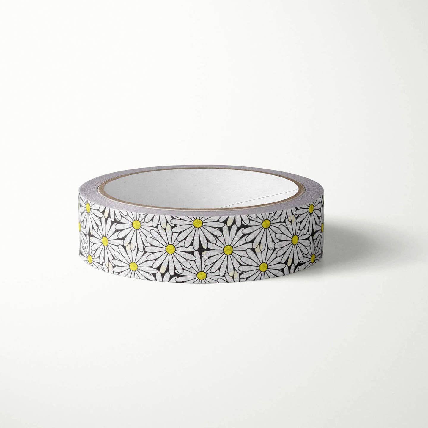 Decorative tape with black background with white daisies with yellow centers. 