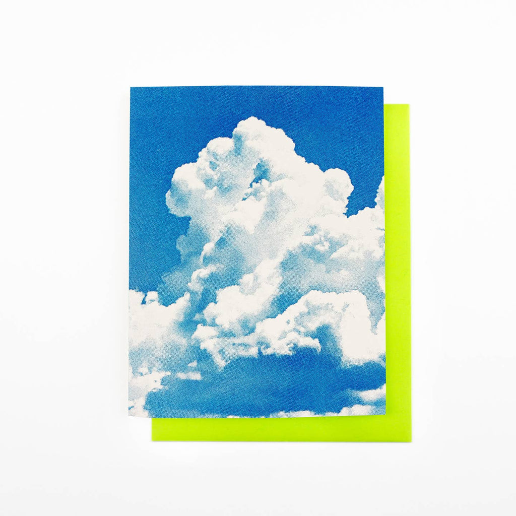 Greeting card with blue background and white clouds. Neon yellow envelope included. 