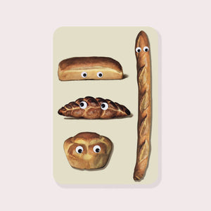 Decorative sticker with tan background with images of loaves of bread with googly eyes. 