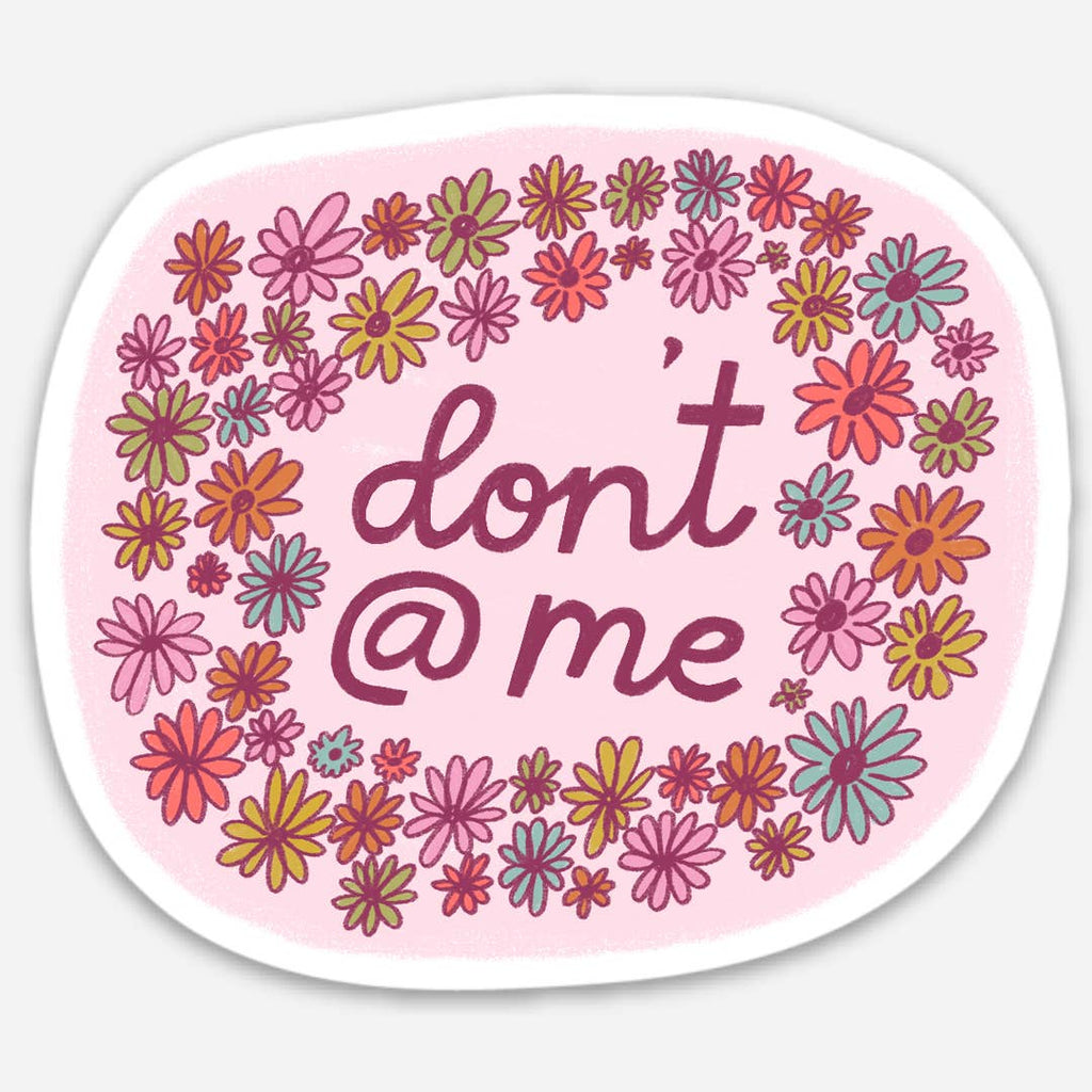 Sticker with pale pink background with flowers in red, green, blue and pink and  magenta text says, "don't @ me". 