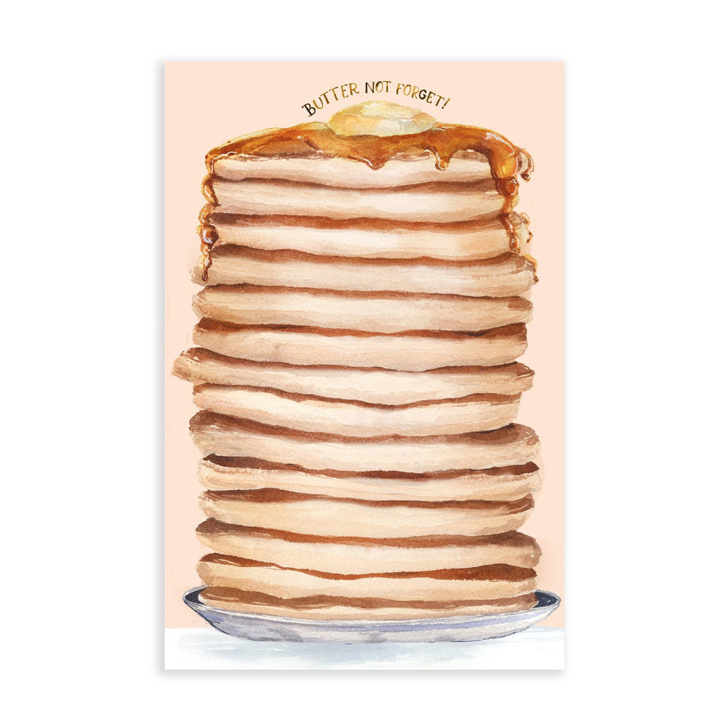 Notepad with peach background and image of a stack of pancakes with butter and syrup melting down on a plate. Gold foil text says, "Butter not forget!". 