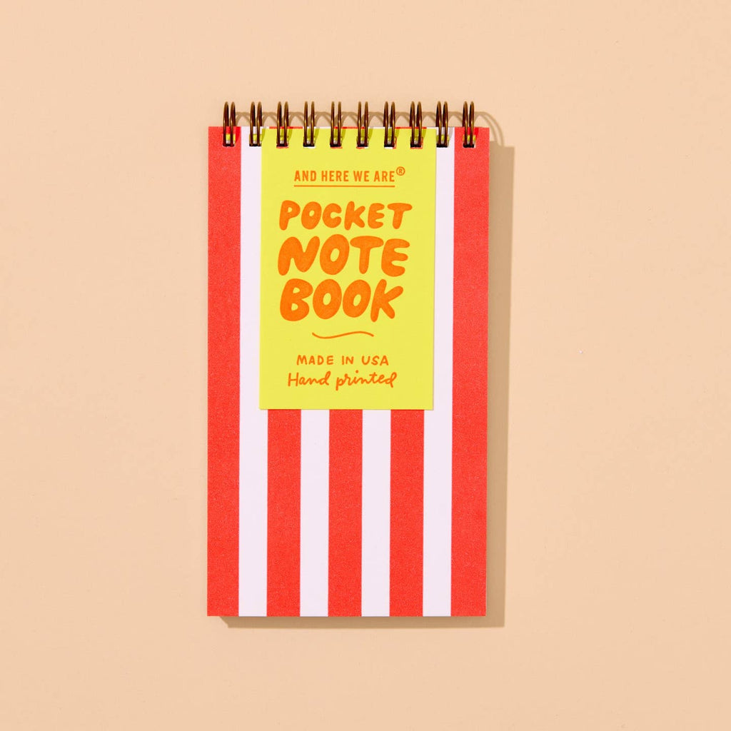 Image of a red and white striped notepad with coiled binding on top. 