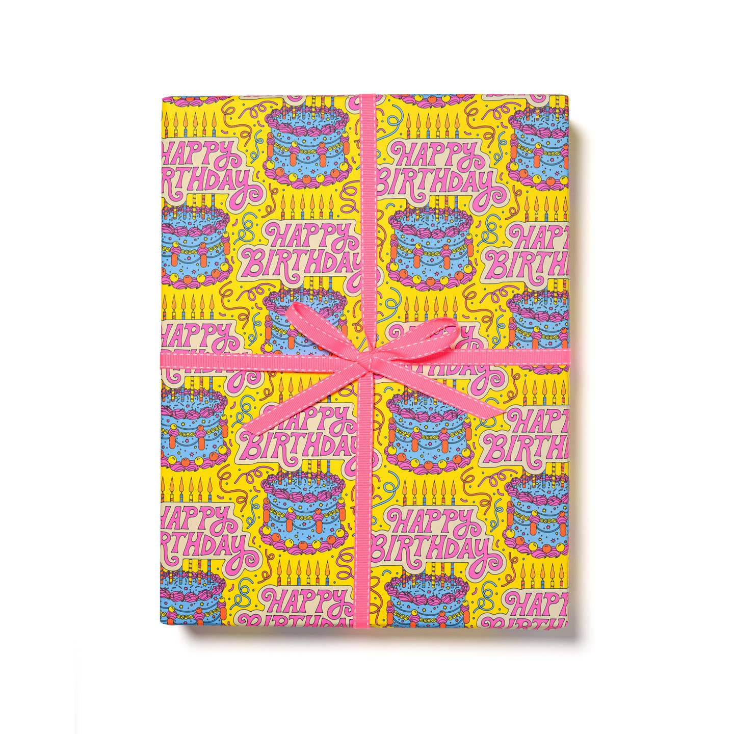 Gift wrap with yellow background with colorful confetti and images of a blue birthday cake and pink text says, "Happy Birthday". 