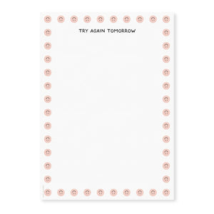 Image of notepad page with white background and images of upside down smiley faces on border and black text at top says, "Try again tomorrow".