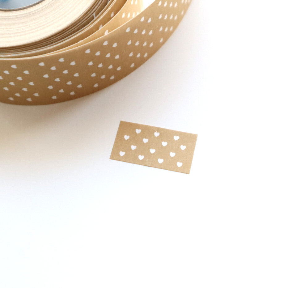 Label sticker with tan background and white dots. 