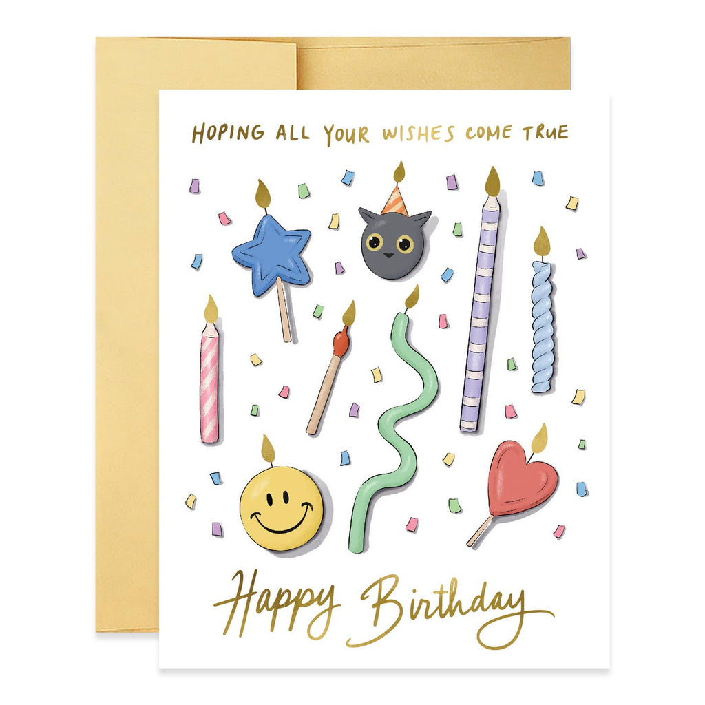 Greeting card with white background and images of candles in various forms including heart, cat, smiley face and star. Gold foil text says, "Hoping all your wishes come true Happy Birthday". Envelope included. 