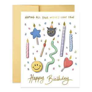 Greeting card with white background and images of candles in various forms including heart, cat, smiley face and star. Gold foil text says, "Hoping all your wishes come true Happy Birthday". Envelope included. 