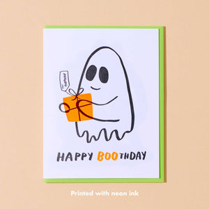 White background with black outlined ghost holding orange gift. Black and orange text says, “Happy Boothday”. Bright green envelope included. 