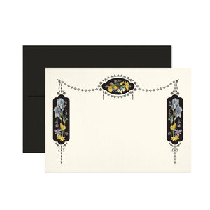 Notecard set with white background and images of black ovals with images of flowers and birds on border of card. Black envelopes included. 