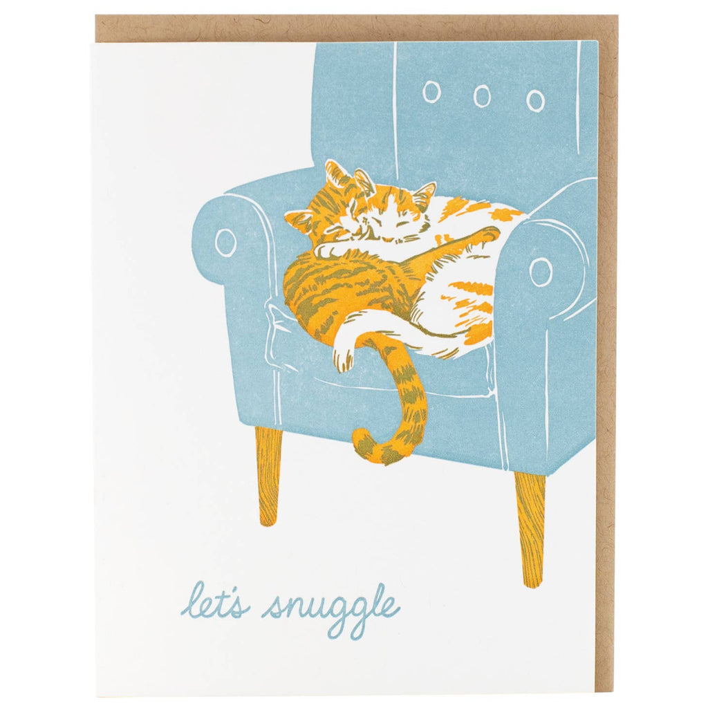 White background with image of blue chair with two cats snuggling together  with blue text says, "Let's snuggle". Kraft envelope included. 