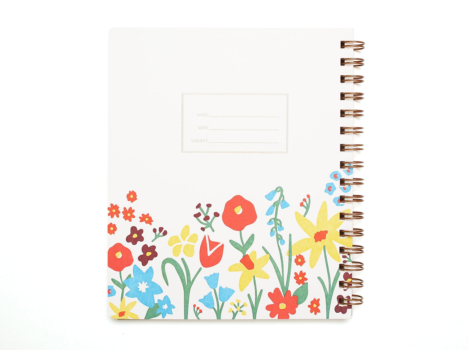 White background with garden flowers at the bottom of cover in red, yellow, blue and green with embossed rectangle with embossed text says, “Name”, “Date”, and “Subject”. Brass coil binding on right side. 